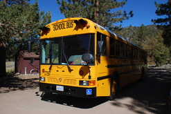 Wheelchair School Bus stopped in an outdoor education camp site